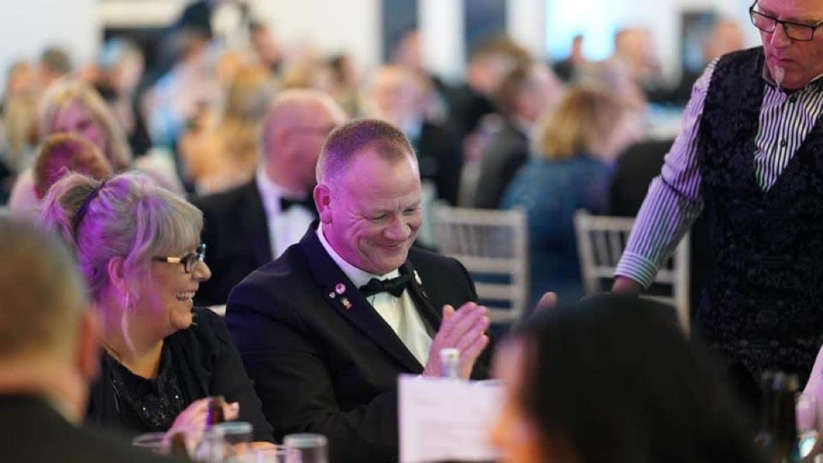 Roy at corporate event